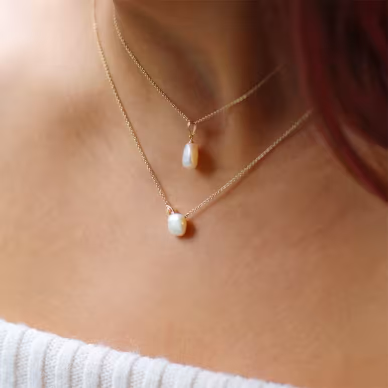 8mm white Keshi freshwater pearl 9ct yellow gold pendant paired with 8mm white Keshi freshwater pearl white topaz 9ct yellow gold necklace