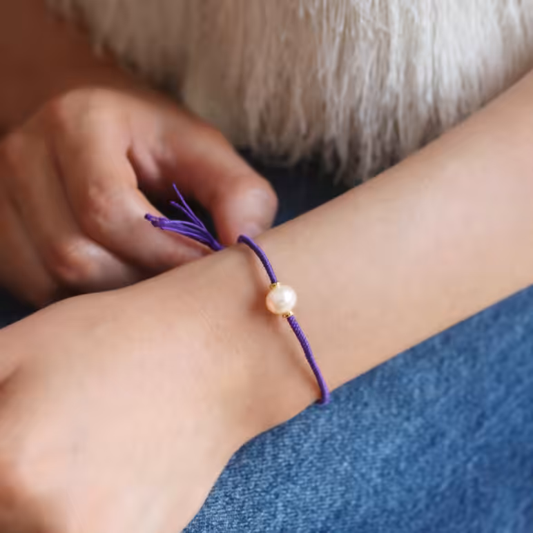 6mm freshwater pearl adjustable tassel bracelet on recycled plastic coloured thread