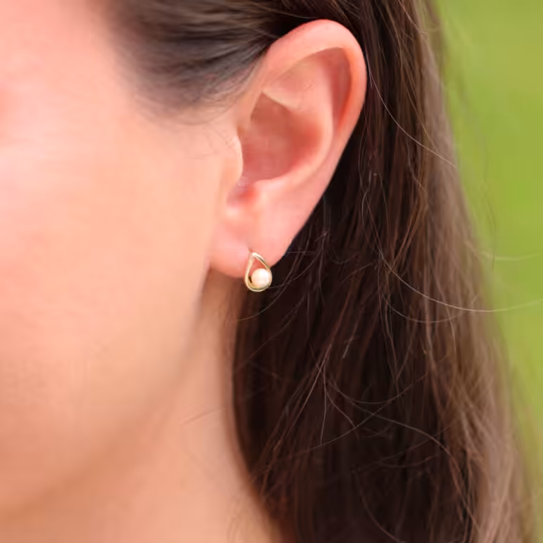 Model wearing Jersey Pearl 9ct yellow gold Akoya pearl cradle stud earrings