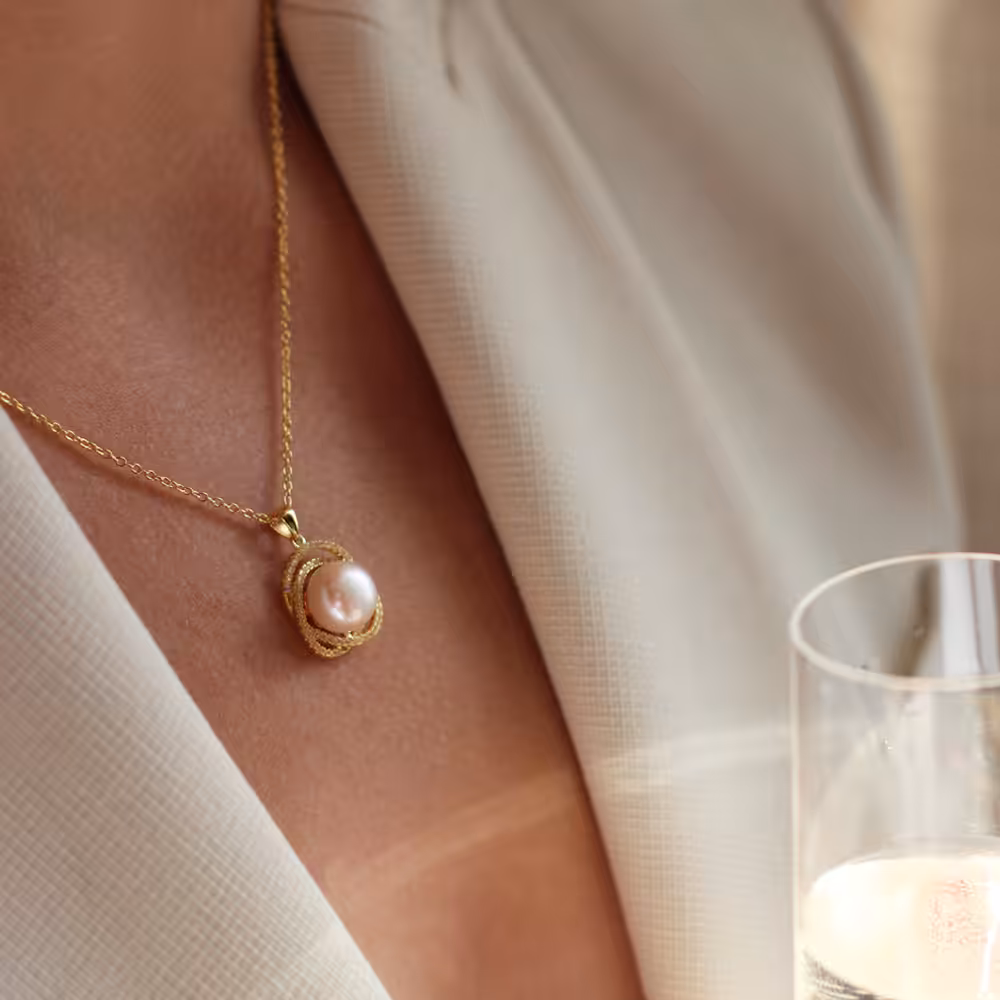 gold sparkly Marette pearl pendant on model