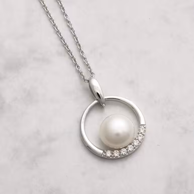 Jersey Pearl Freshwater Pearl Pendant set with White Topaz on Sterling Silver