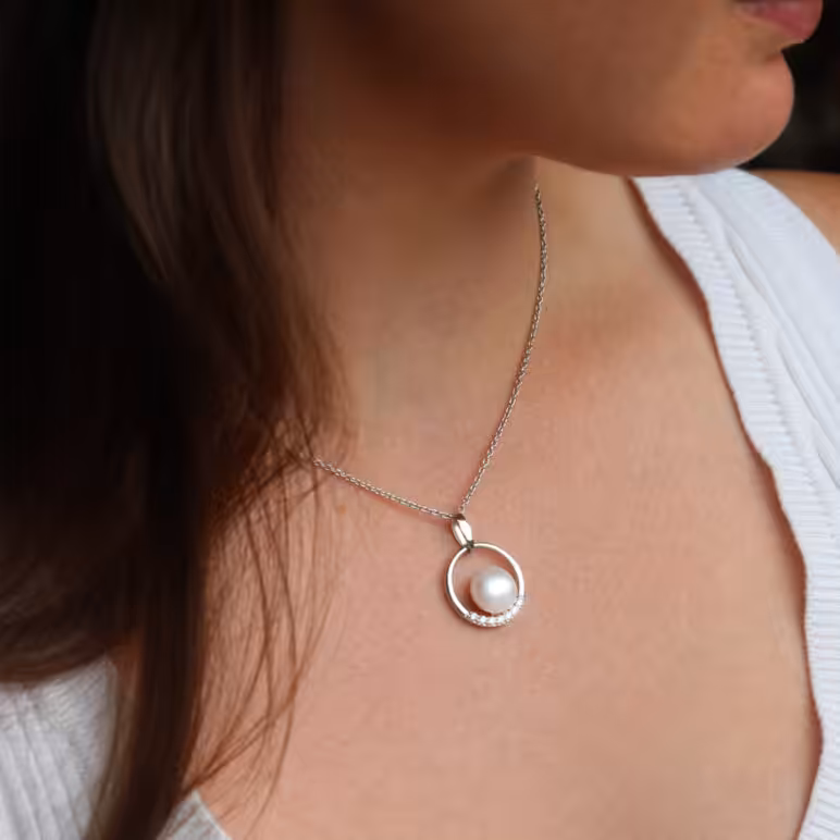 Jersey Pearl Circle Freshwater Pearl Pendant set with White Topaz on Sterling Silver