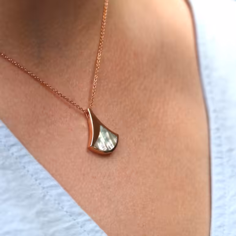 women wearing Jersey Ormer rose gold plated sterling silver pendant