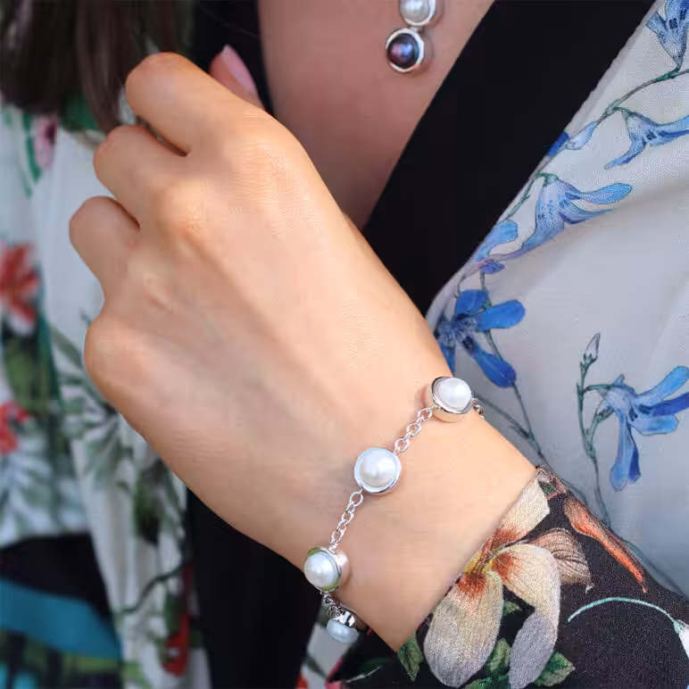 Model wearing Jersey Pearl Alice Bracelet White Freshwater Button Pearls set with Sterling Silver
