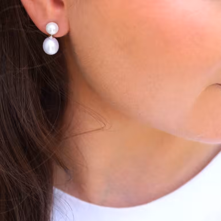 Model wearing Dew Drop Earrings White Freshwter Pearls on Sterling Silver