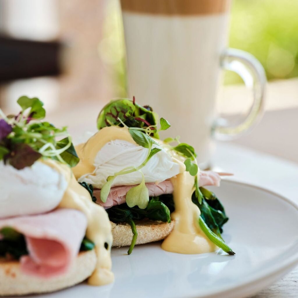 eggs benedict plate and coffee in the pearl cafe at jersey pearl