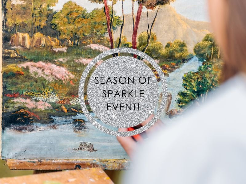 Close up of a lady painting a forrest scene