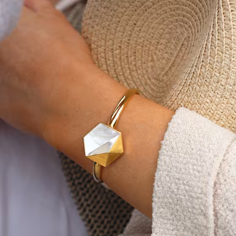 Lifestyle model wearing Kyra gold bangle