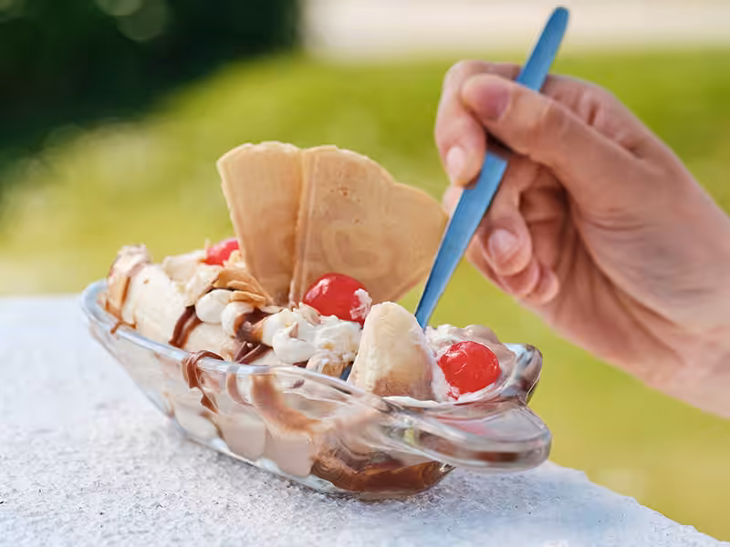 spoon going into banana split in a bowl at jersey pearl