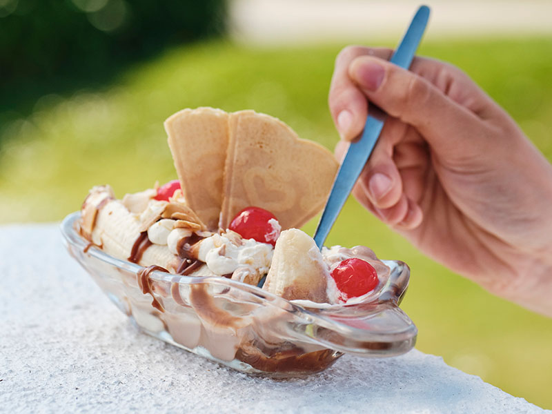 spoon going into banana split in a bowl at jersey pearl