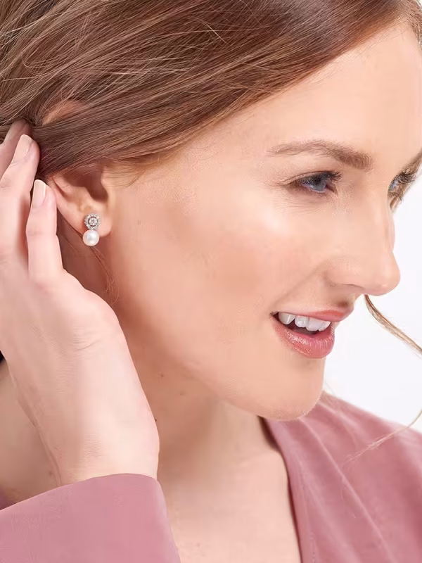Model wearing Amberley Halo Pearl Earrings
