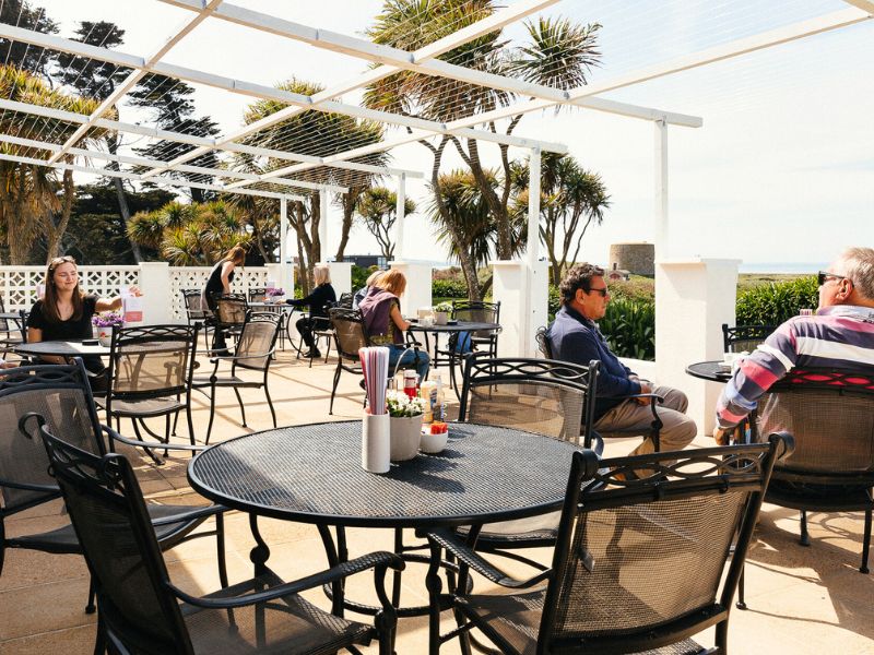 customers sitting outside on the jersey pearl sun terrace