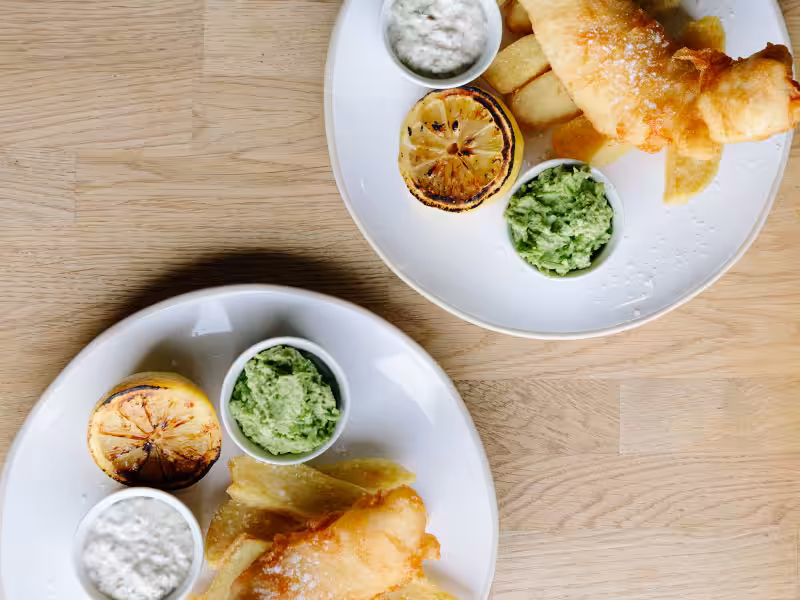 shot of two places of fish and chips in the pearl cafe