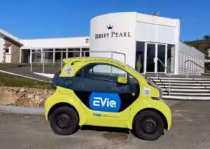 Jersey Pearl St Ouen building and an eco EVie car outside