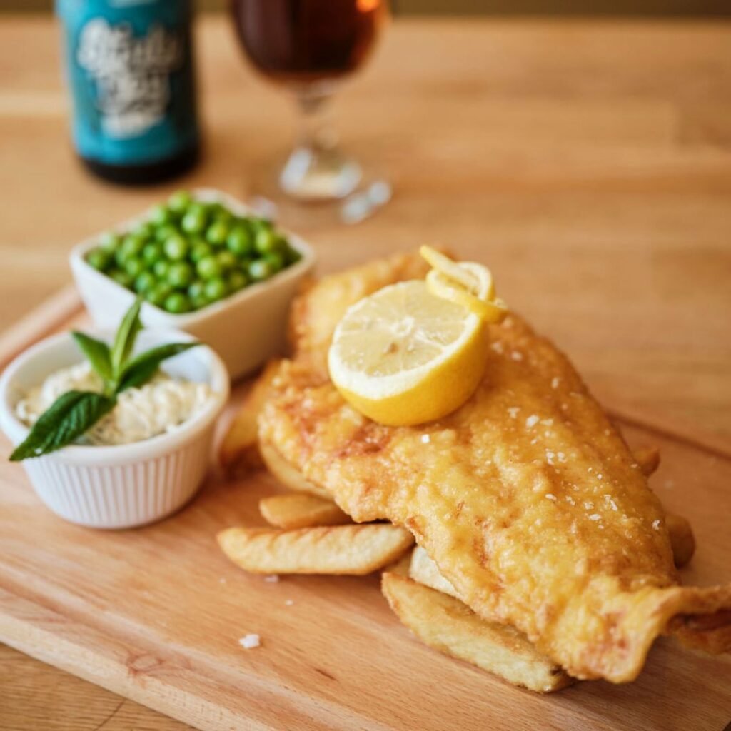 Fish and chips on a wooden platter from the pearl cafe