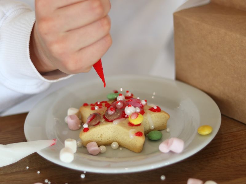 child decorating shortbread in the jersey pearl cafe