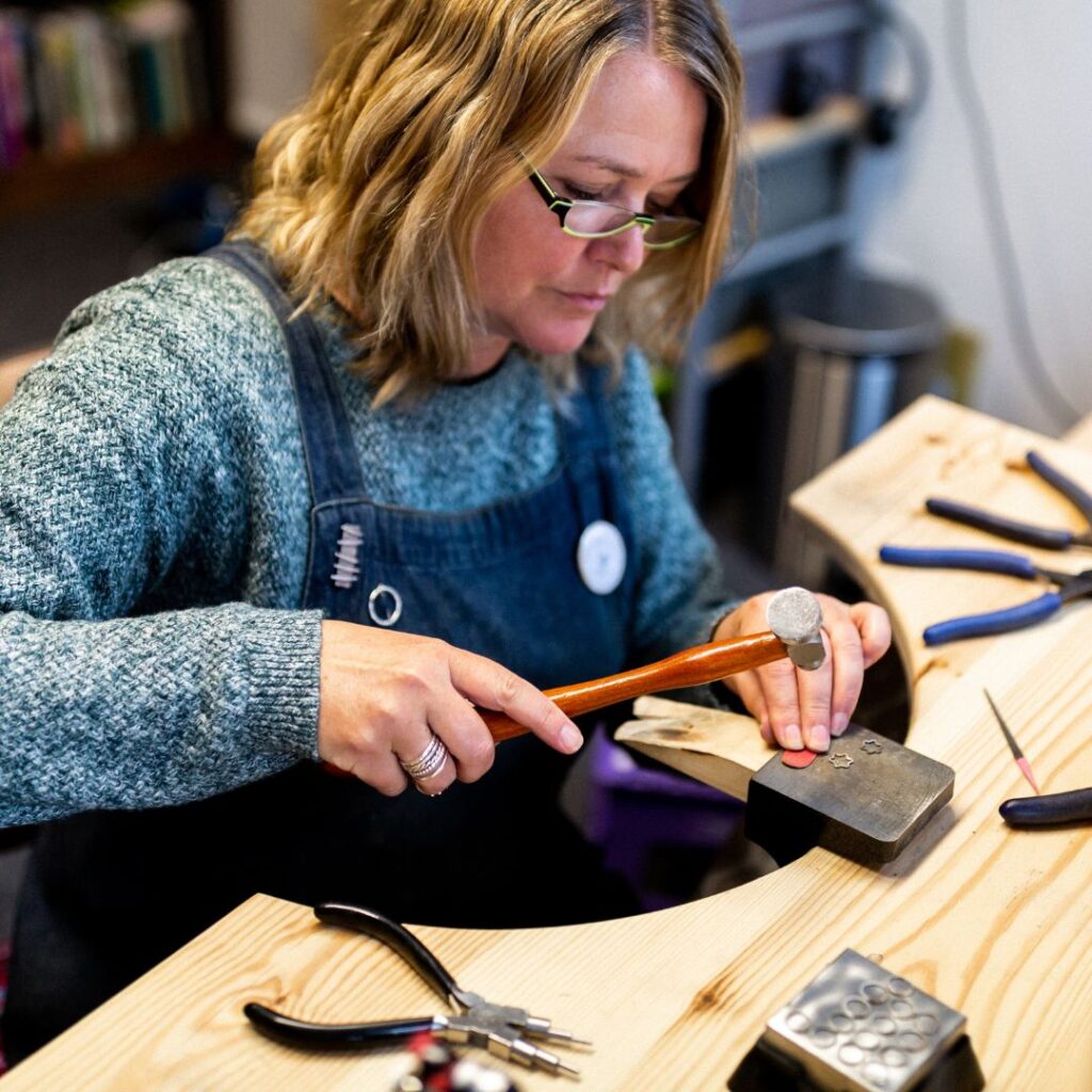 photo of jewellery designer Lisa lebroq at work in her studio