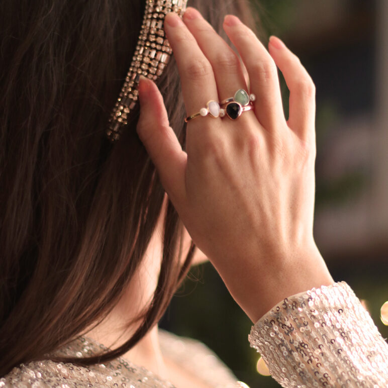 sorel pearl rings model wearing sparkly Christmas clothes and jersey pearl sorel rings