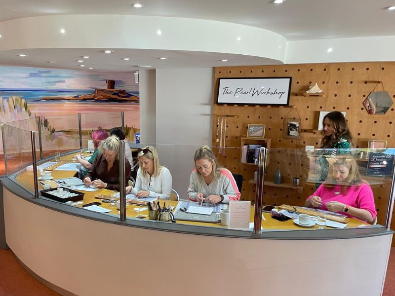 ladies learn how to professionally pearl string at jersey pearl st ouen